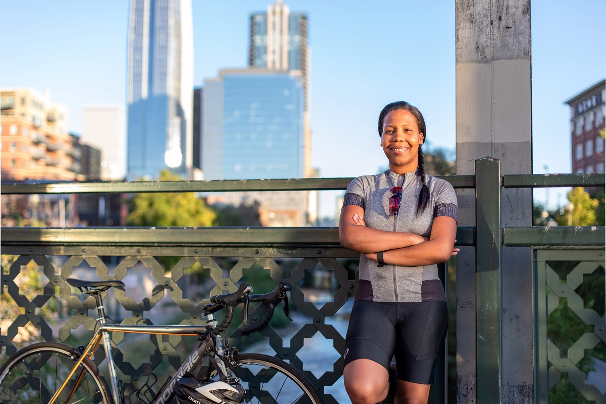 Stephanie Puello and her bike on a Denver bridge