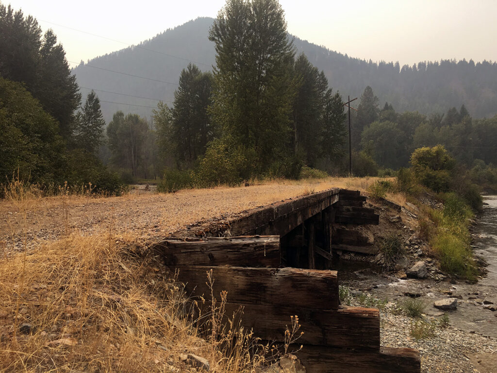 Old rail road bridge resurfaced with gravel in a dry area.