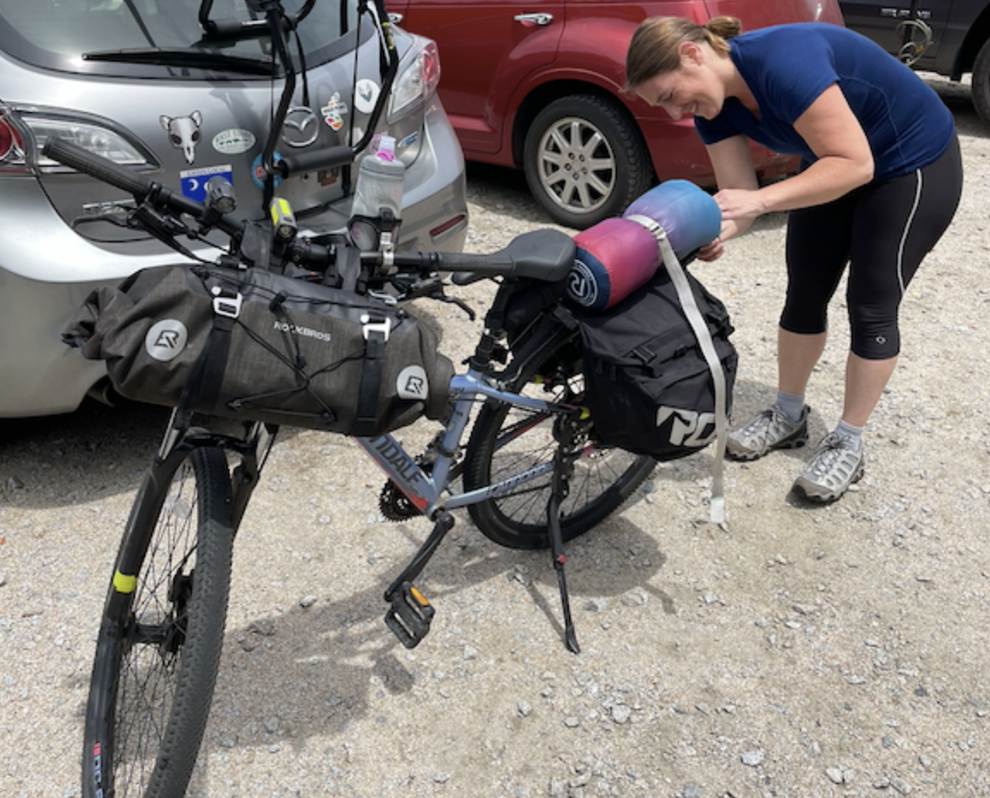 a woman bent over a bike