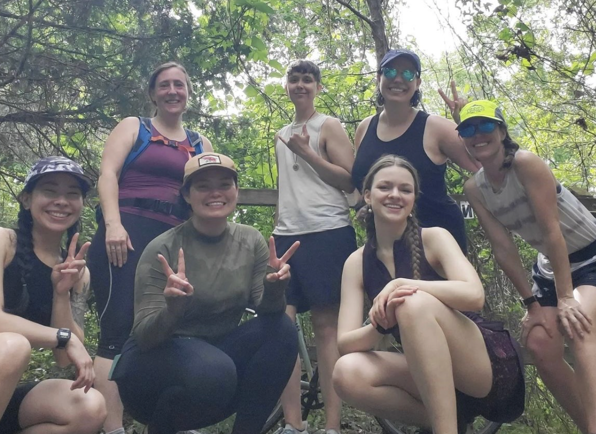 a group of women in the woods