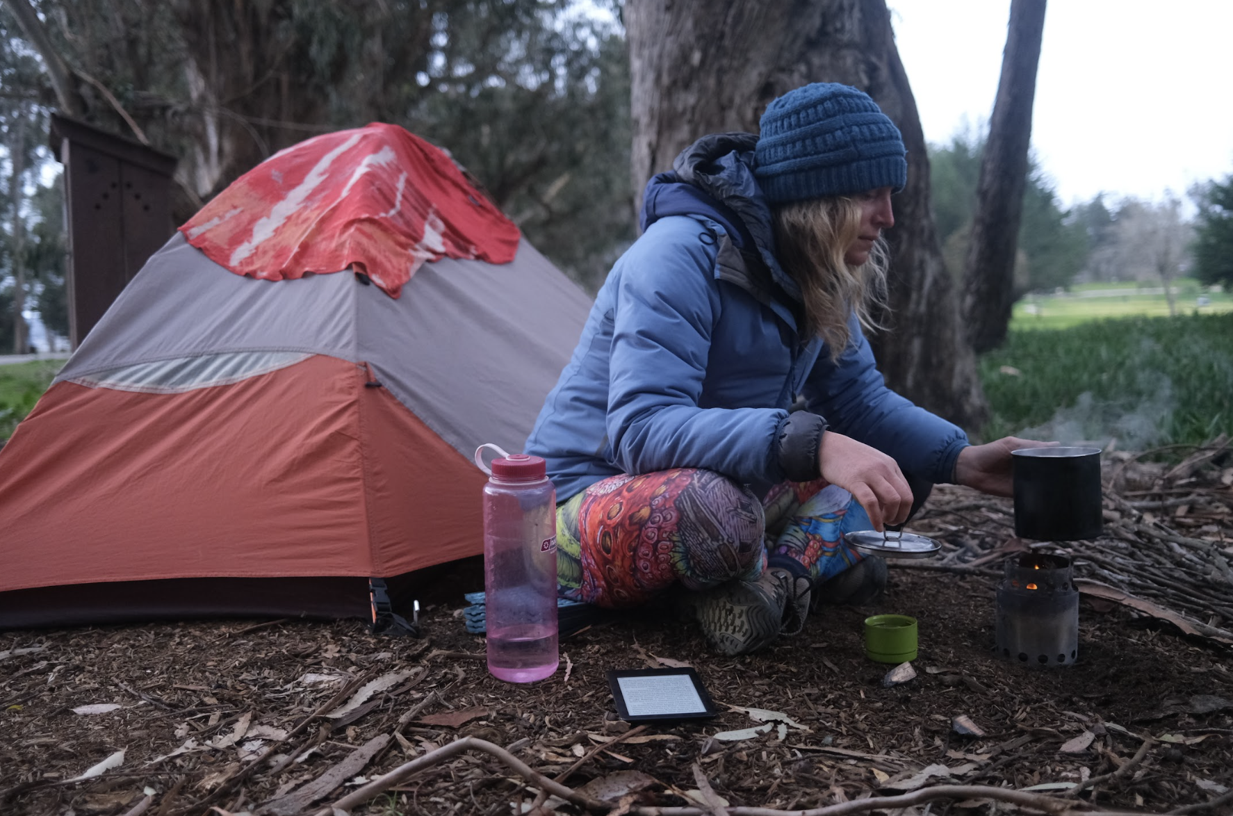 a woman in front of tent